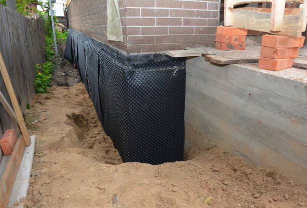 Happy homeowners after waterproofing job in Hartland